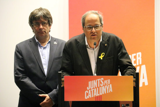 The Catalan president, Quim Torra (right), with his predecessor, Carles Puigdemont in Brussels on August 27, 2018 (by Natàlia Segura)